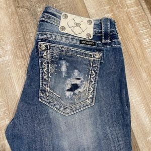 Light wash distressed miss me jeans